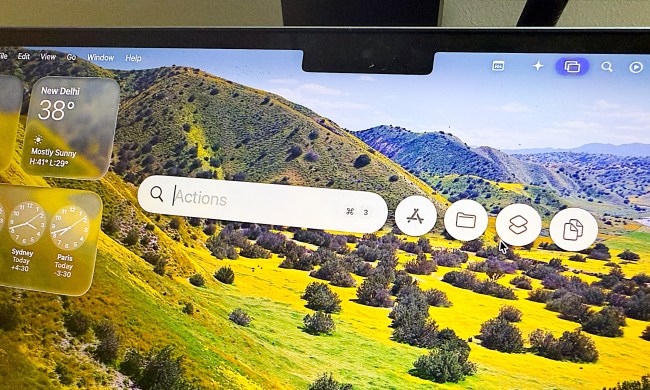 Using Spotlight in macOS Tahoe on a MacBook Air.