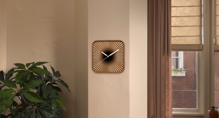A clock widget on a wall in visionOS 26